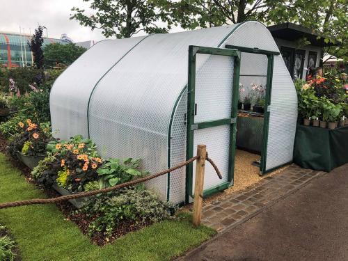 3m wide, 4m long greenhouse in show setting with staging